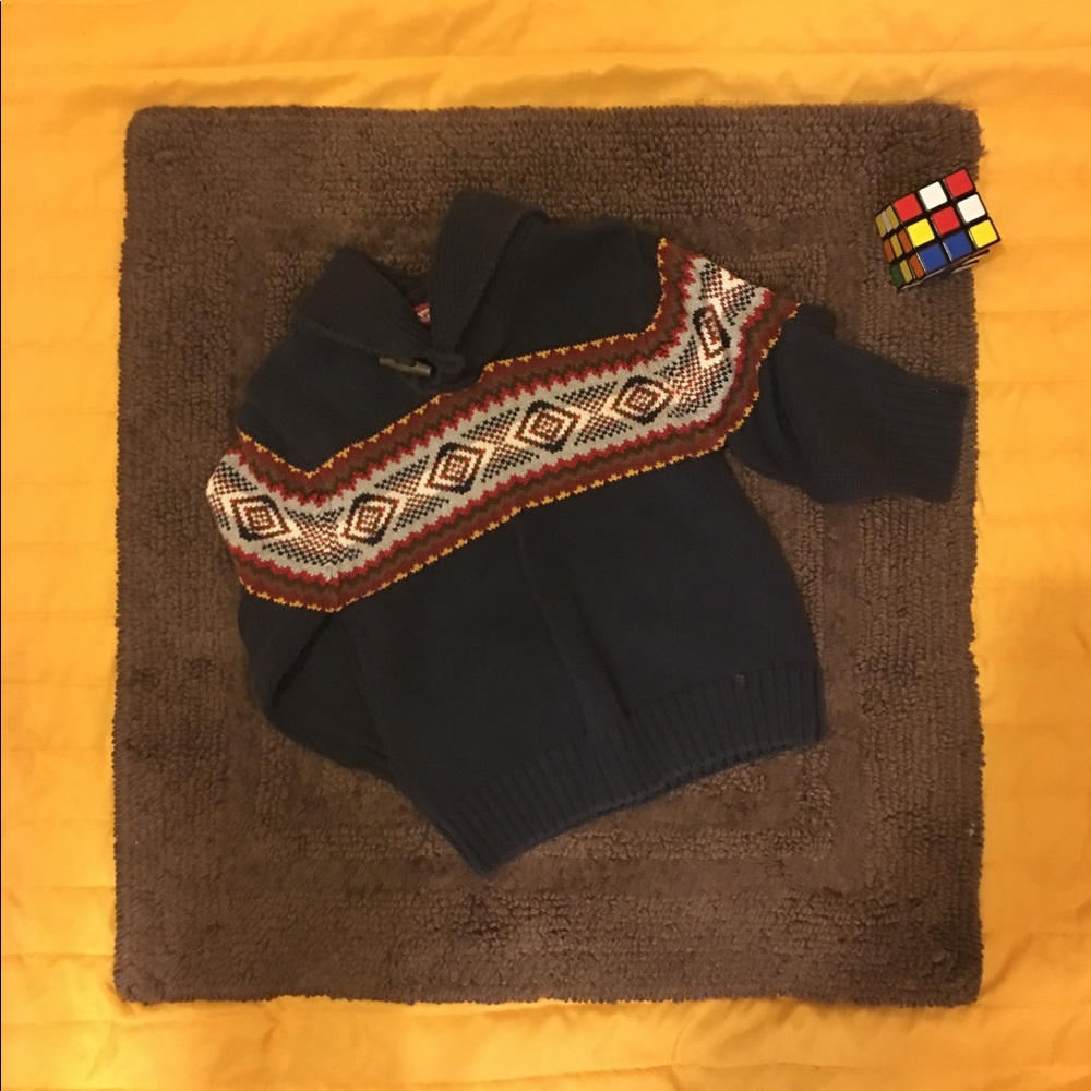 Navy blue shawl neck sweater.